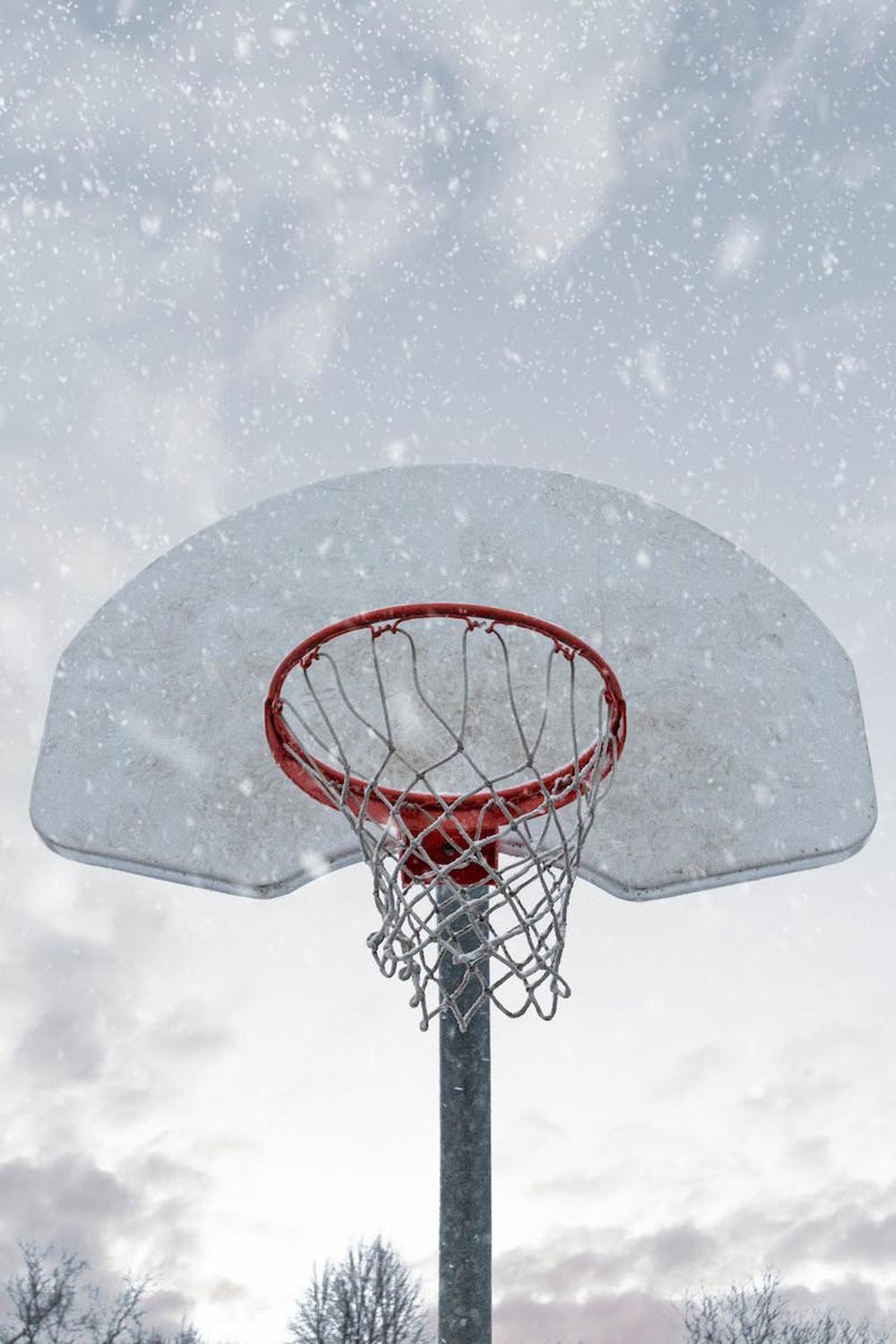 photo_of_basketball_hoop_while_snowing